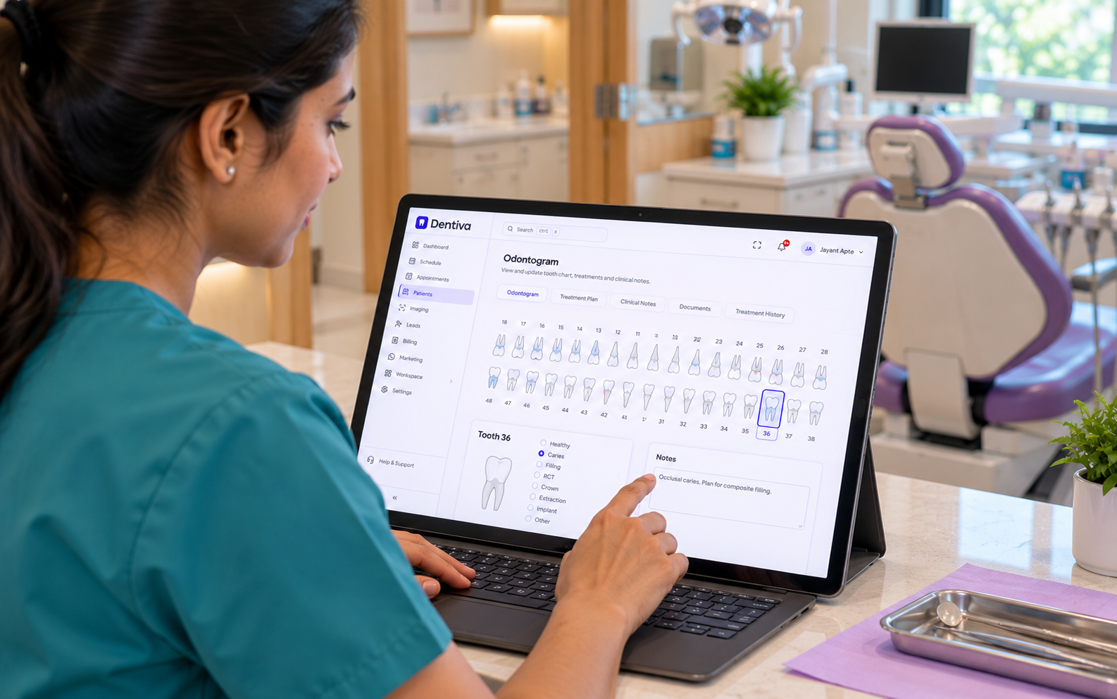 Dentist reviewing the Dentiva odontogram and tooth-level clinical notes on a laptop.
